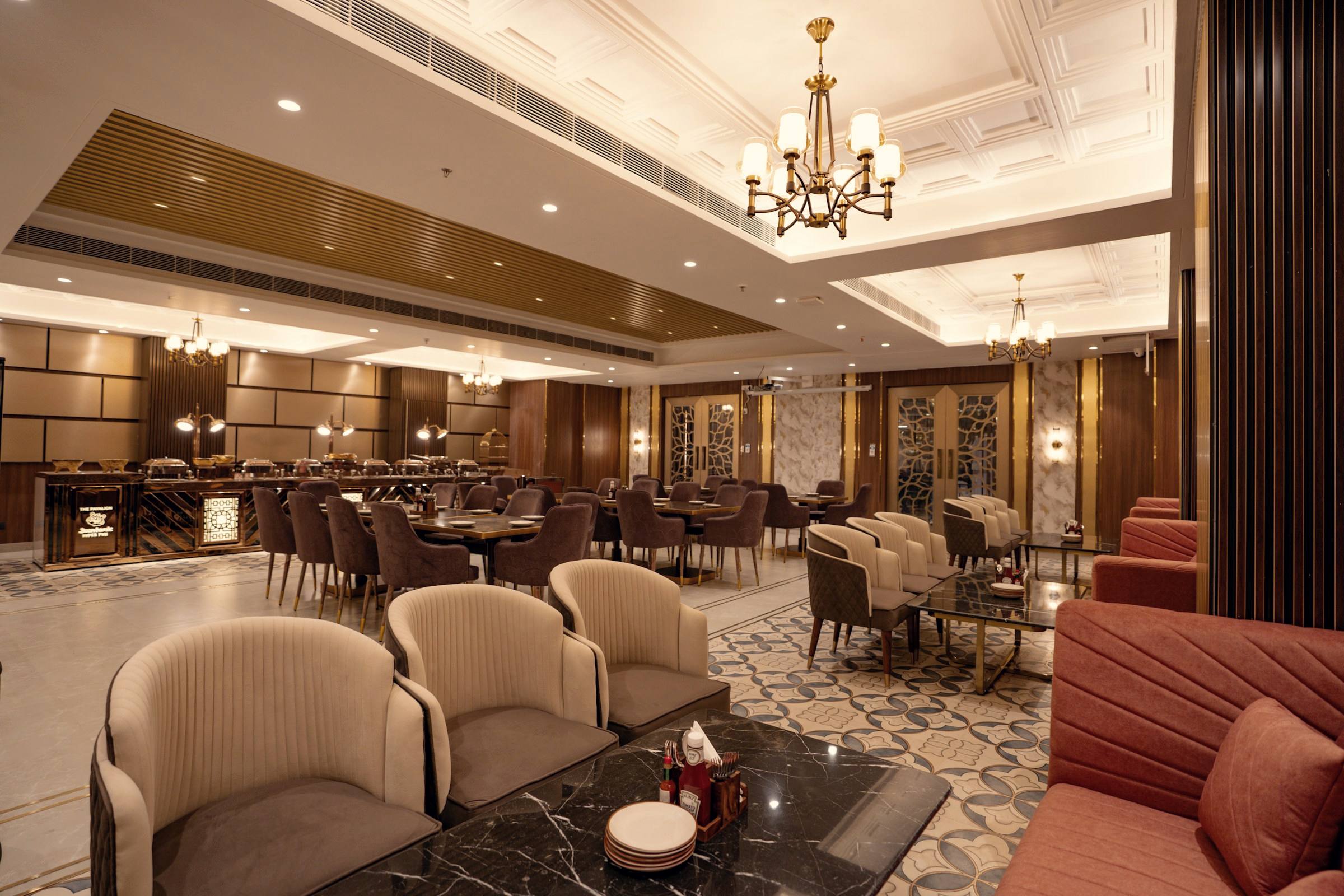 An Indian banquet hall under a chandelier